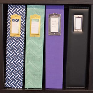 Craft Vinyl organized in scrapbooks by type on a shelf