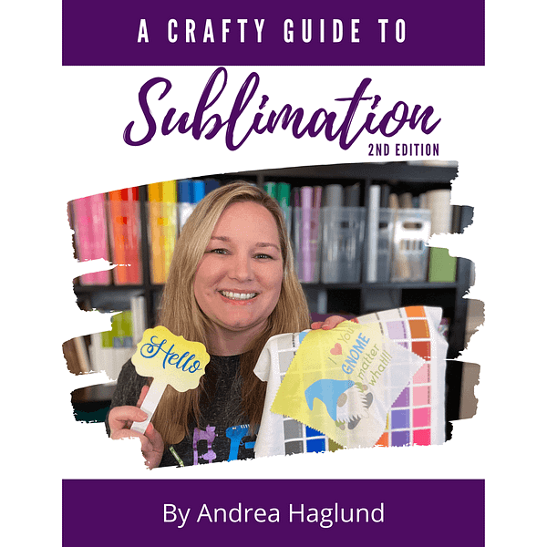 A Crafty Guide to Sublimation 2nd Edition Photo of a Female Blonde Smiling with a Hello Sign, Gnome Lens Cloth over a Color Chart. Vinyl Rolls on a Book Case behind her. By Andrea Haglund